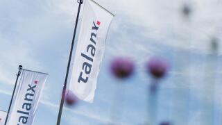 Hanover, Germany. 11th May, 2016. Flags that read 'Talanx' flying in front of the Hannover Congress Centrum at the Talanx shareholders' meeting in Hanover, Germany, 11 May 2016. The insurance company reported the second-highest full-year profit in its his
