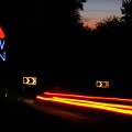 dangerous drive and speeding at night on the hairpin bend road. Slow DOWN sign