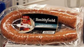 Smithfield Foods products are displayed at a local grocery store Thursday, June 5, 2008, in Columbia, S.C. Simthfield Foods Corp., the nation's largest hog producer and pork processor, said Thursday that fourth-quarter profits fell 94 percent, hurt by ris