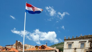 Croatia Flag flying in front of the Sponza Palace, Dubrovnik
