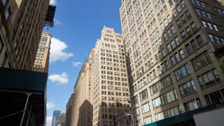 1920s office buildings looking up seventh avenue midtown New York City USA