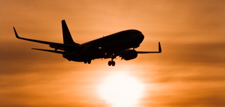 Aircraft against setting sun