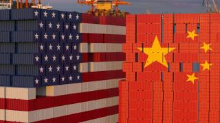 Stacks of Containers in the seaport stacked in the shape of the US flag and opposite in the shape of the flag of China