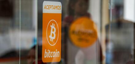 A bitcoin acceptance sign seen in San Salvador. The Bukele administration has ended its fourth year in office ahead of a questioned reelection bid. The country has been placed under an ongoing state of emergency to combat gangs that has been in place for