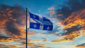 Quebec Flag on Sunset Sky