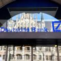 Deutsche Bank logo on the window of a branch in Munich