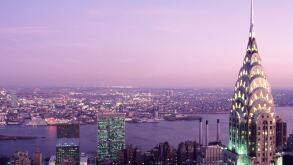 Chrysler Building illuminated evening sky. United Nations Building Commercial real estate The East River New York City skyline from above, Midtown USA