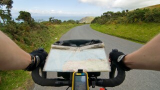 A GPS and map on a bicycle tour along the coast of Exmoor near hunters inn, Devon