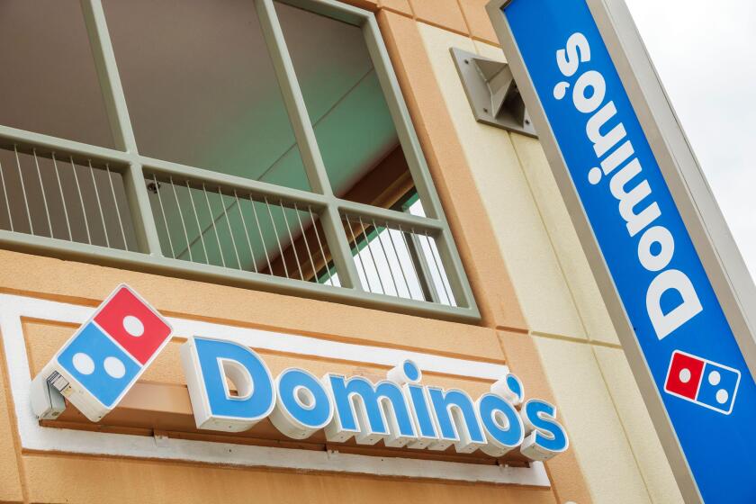 Orlando Florida,UCF University of Central Florida campus,Domino's Pizza restaurant,fast food chain,storefront signage logo,outside exterior,branding p