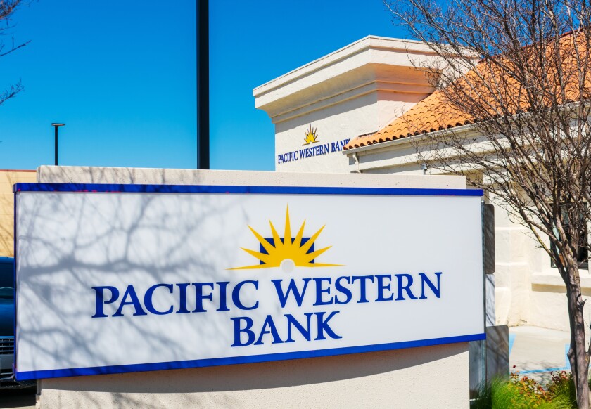 Pacific Western Bank sign, logo at bank branch facade. - Paso Robles, California, USA - 2021