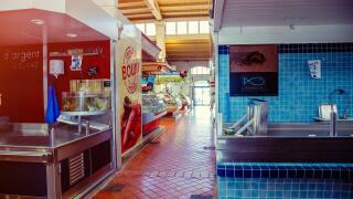 La Rochelle, France - July 24, 2017:Close up of closed merchant counters in a vintage covered market of La Rochelle