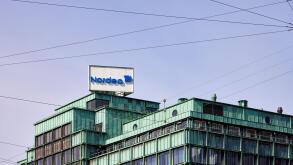 Nordea Bank sign on top of office building Vesterport (designed by Povl Baumann & Ole Falkentorp, 1932); Copenhagen, Denmark
