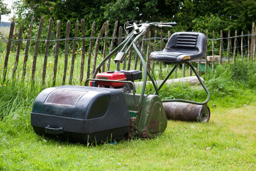 Traditional ride on rotary lawnmower, Hampshire, England, United Kingdom.