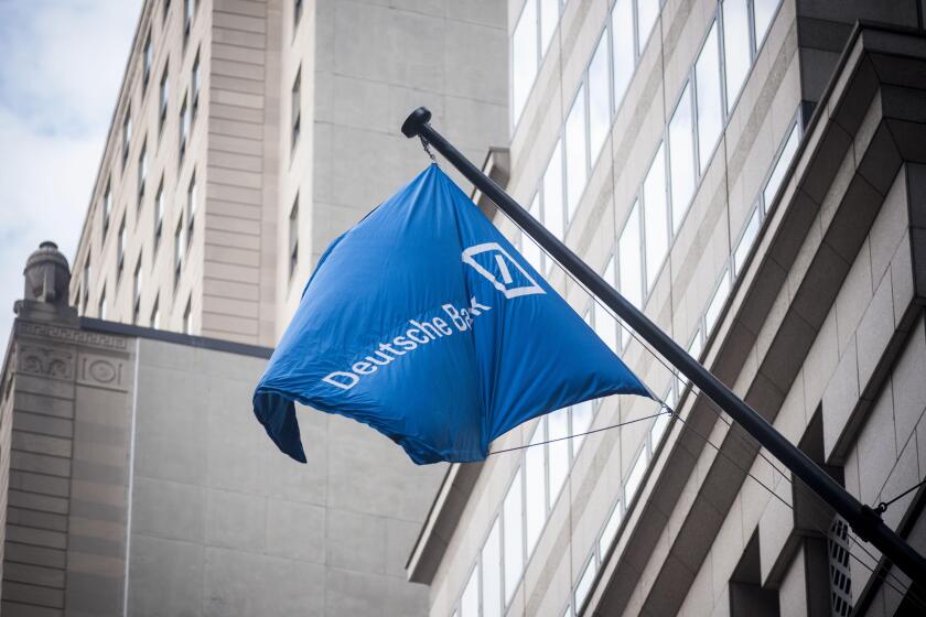 A flag flies outside the Deutsche Bank headquarters on Wall Street in Lower Manhattan in New York on Monday, October 17, 2016. Deutsche Bank has appointed Tom Patrick as its new CEO of its Americas division, the third in less than 18 months. (Photo by Ric