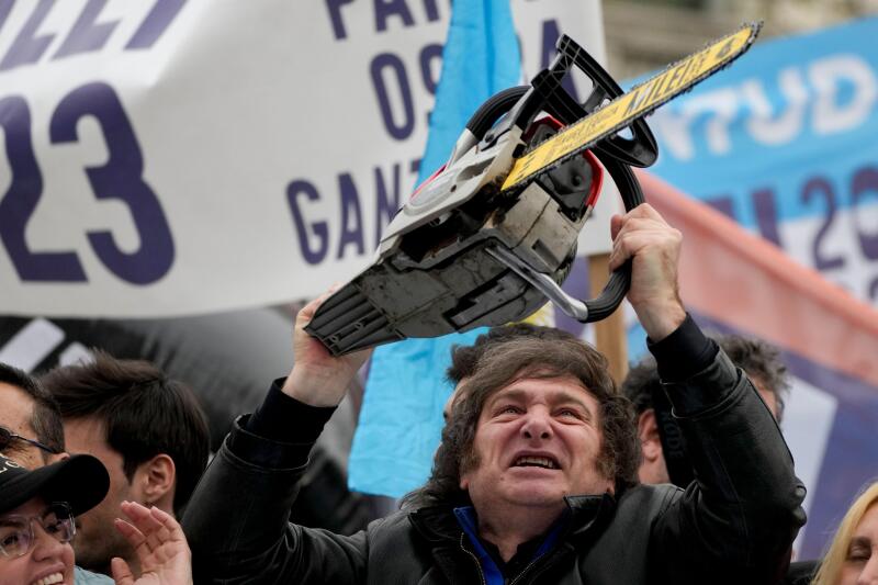 Presidential hopeful of the Liberty Advances coalition Javier Milei brandishes a chainsaw during a campaign event in La Plata, Argentina, Tuesday, Sept. 12, 2023. Milei has used the chainsaw throughout his campaign to symbolize how he will slash governmen