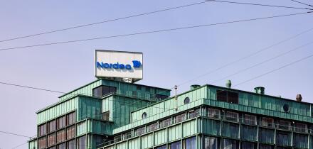 Nordea Bank sign on top of office building Vesterport (designed by Povl Baumann & Ole Falkentorp, 1932); Copenhagen, Denmark