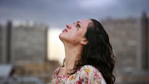 Portrait of a young crying brunette