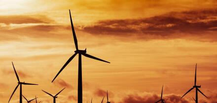 View of wind turbines at sunset at Blacklaw Wind Farm in Scotland, UK