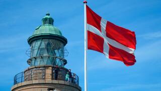 Hammeren lighthouse with Danish flag, Bornholm, Denmark