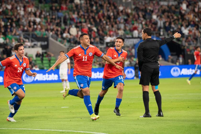 Austin, TX, USA. 8th Dec, 2021. Chile's IVAN MORALES (11) is chased by teammates CLEMENTE MONTES (28) and MARCELINO NUNEZ (10) after Morales scores a goal during the first half of a Mexico National Team vs. Chile friendly at Austin's Q2 Stadium. The teams