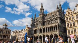 Brussels, Belgium - August 20 2022 : Tourists discovering the famous Grand Place and the historical buildings in Brussels