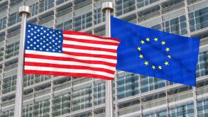 US and European flags waving in the wind (3D rendered)