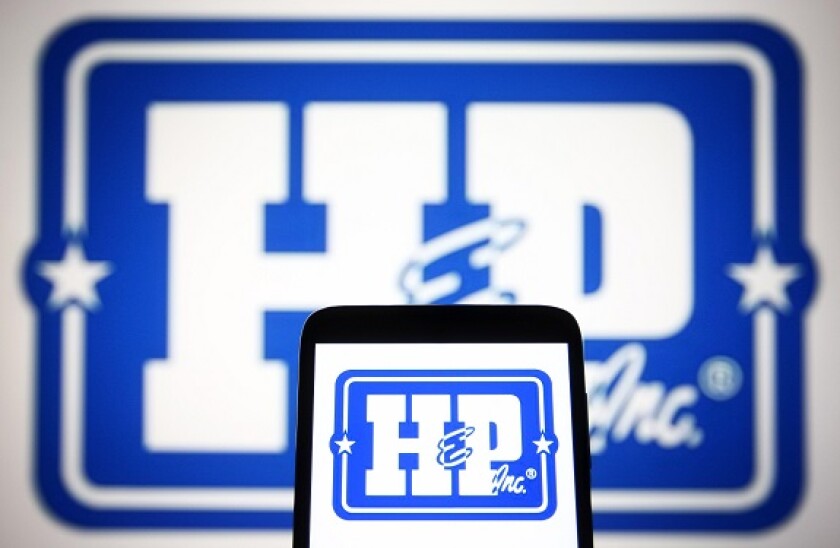 Ukraine. 13th July, 2021. In this photo illustration, Helmerich & Payne, Inc. logo is seen on a smartphone and a pc screen. Credit: Pavlo Gonchar/SOPA Images/ZUMA Wire/Alamy Live News