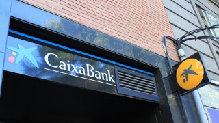 CaixaBank branch in Madrid (Spain). Caixabank and Bankia merge, creating the largest bank in Spain. / Ana Bornay