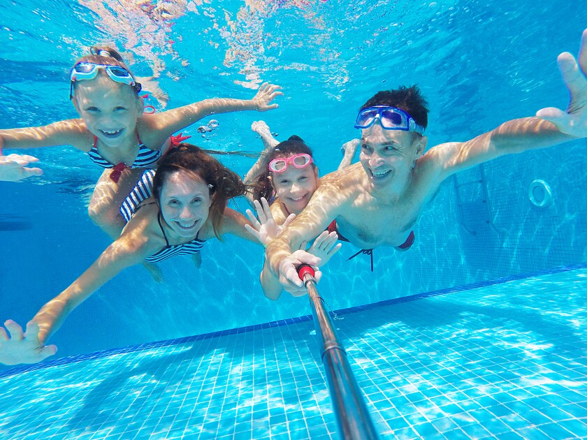 family in swimming pool