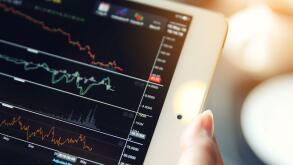 trading online on tablet with bussiness woman hand