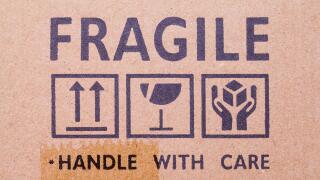Cardboard Box With Fragile Stamp and Symbols.