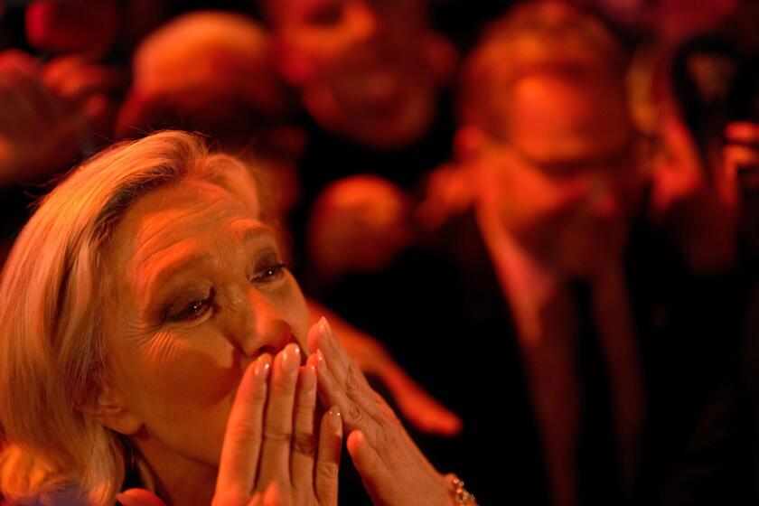 French far right leader Marine Le Penblows a kiss after delivering her speech after the release of projections based on the actual vote count in select constituencies , Sunday, June 30, 2024 in Henin-Beaumont, northern France. French voters propelled the