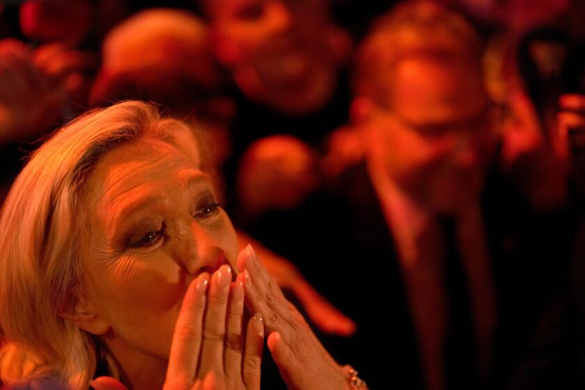 French far right leader Marine Le Penblows a kiss after delivering her speech after the release of projections based on the actual vote count in select constituencies , Sunday, June 30, 2024 in Henin-Beaumont, northern France. French voters propelled the 