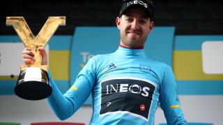 Team Ineos' Chris Lawless celebrates winning the Tour de Yorkshire with the trophy.