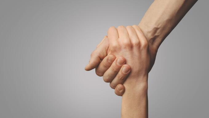 help friend through a tough time. rescue gesture. support, friendship and salvation concept. holding hands