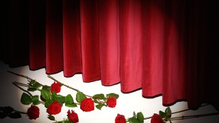 THEATRE CURTAIN CALL WITH RED ROSES