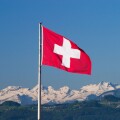 Swiss flag and Alps