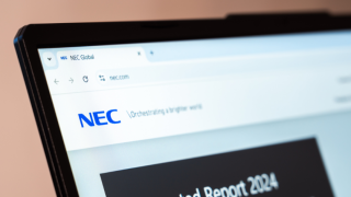NEC global technology and IT solutions company website displayed on laptop screen