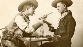 Cowboy Card Game Ends in Standoff. Image shot 1910. Exact date unknown.