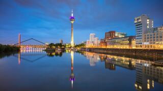 Dusseldorf, Germany. Cityscape image of Dusseldorf, Germany with the Media Harbour and reflection of the city in the Rhine river, during twilight blue