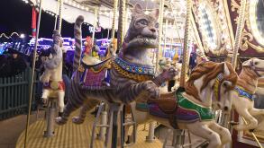 Cat on a carousel at Winter Wonderland, Hyde Park, London, UK 2020