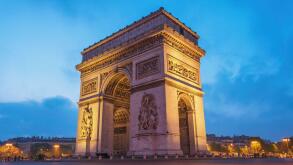 Paris France city skyline night at Arc de Triomphe and Champs Elysees empty nobody