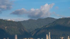 A beautiful view of a mountainous landscape with high and modern buildings in Bogota, Colombia