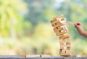 The jenga game ,tower stack from wooden blocks toy and  hand tak
