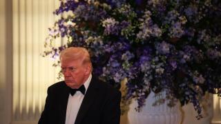 Washington, United States Of America. 21st Feb, 2026. United States President Donald J Trump lowers his head in prayer during the Governors Dinner in the East Room of the White House on February 21, 2025 in Washington, DC Credit: Samuel Corum/Pool via CNP