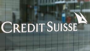 The logo of the Credit Suisse bank is written on the window of the bank in Bel-air Square in Geneva, Switzerland.