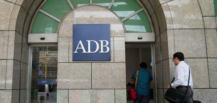 A man enters the Asian Development Bank (ADB) headquarters in Manila, Philippines on Tuesday, April 15, 2025. (AP Photo/Aaron Favila)