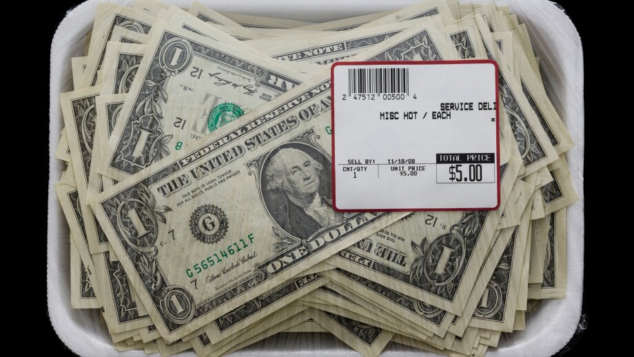 us dollars in a supermarket shrinkwrap package