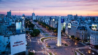 View over Avenida 9 Julio and the obelisk in Plaza Republica, Buenos Aires, Argentina.