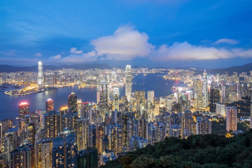 Night skyline of Hong Kong and Victoria Harbour from The Peak on a clear day